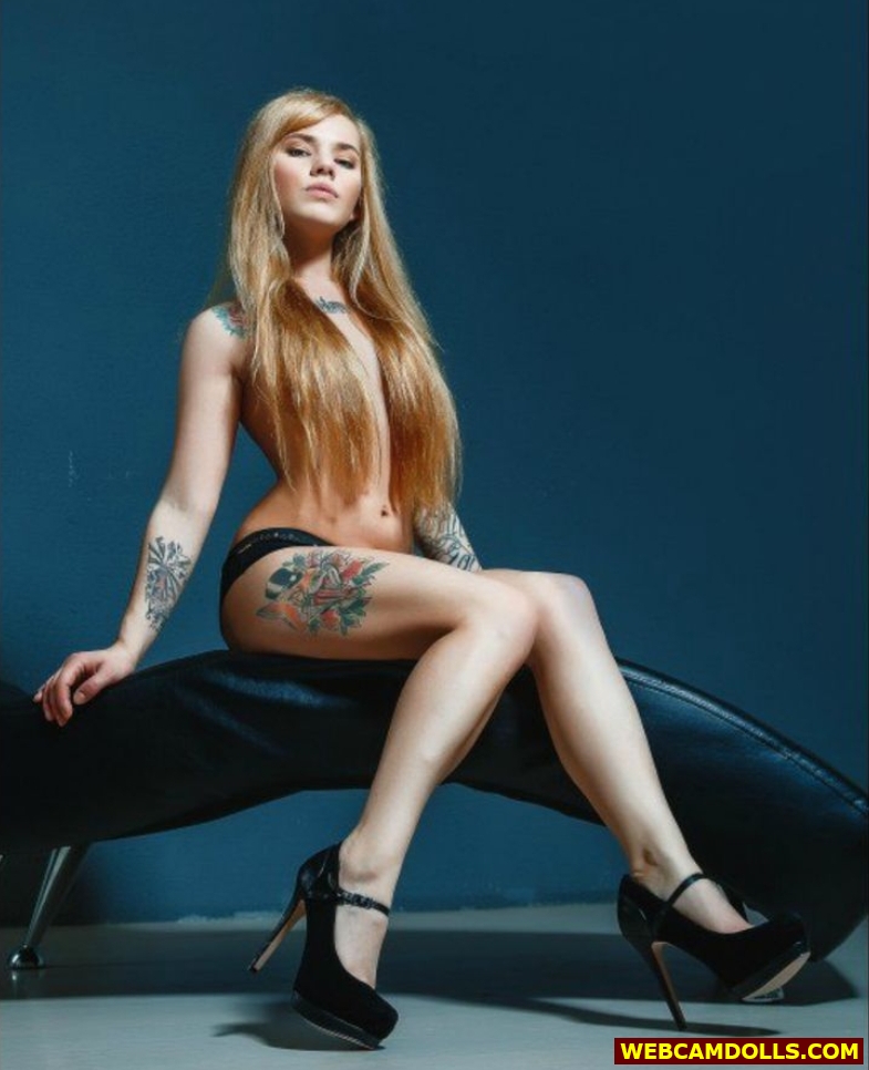 Blonde Young Tattooed Slut in Black Panty and Black High Heels on Webcamdolls